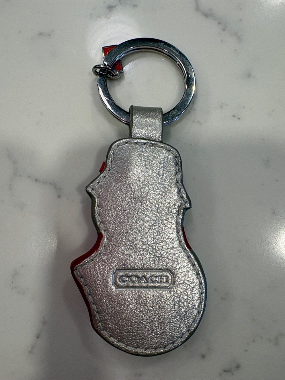 Coach Silver Snowman Keychain with Red Accents and Brown Hat - Picture 2 of 2
